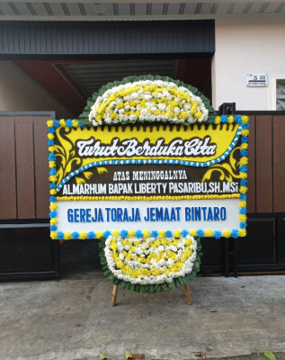 Papan Bunga Duka di Anggilowu